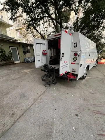Magnet Plumbing service vehicle on-site for Grease Trap Cleaning in Overview